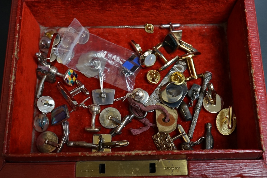 A small group of assorted jewellery and other items including a Victorian white metal albert, hung with a silver vesta case, a pair of gilt metal lorgnettes, cufflinks, scarab brooch and a white metal propelling pencil,